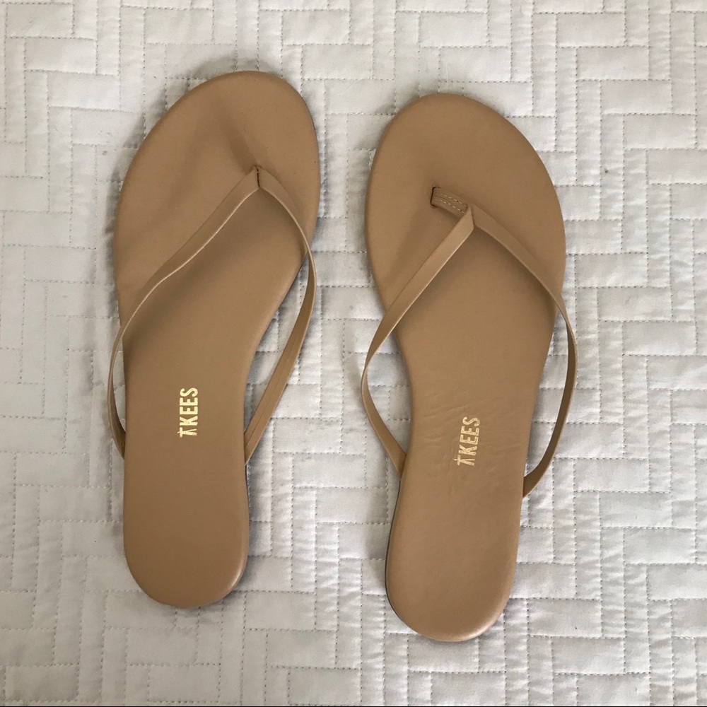 Tan tkees flip flops in size 8